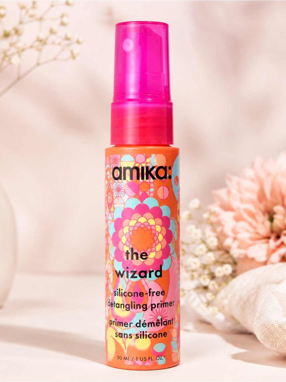 amika The Wizard Detangling Primer - Pink & Orange Bottle